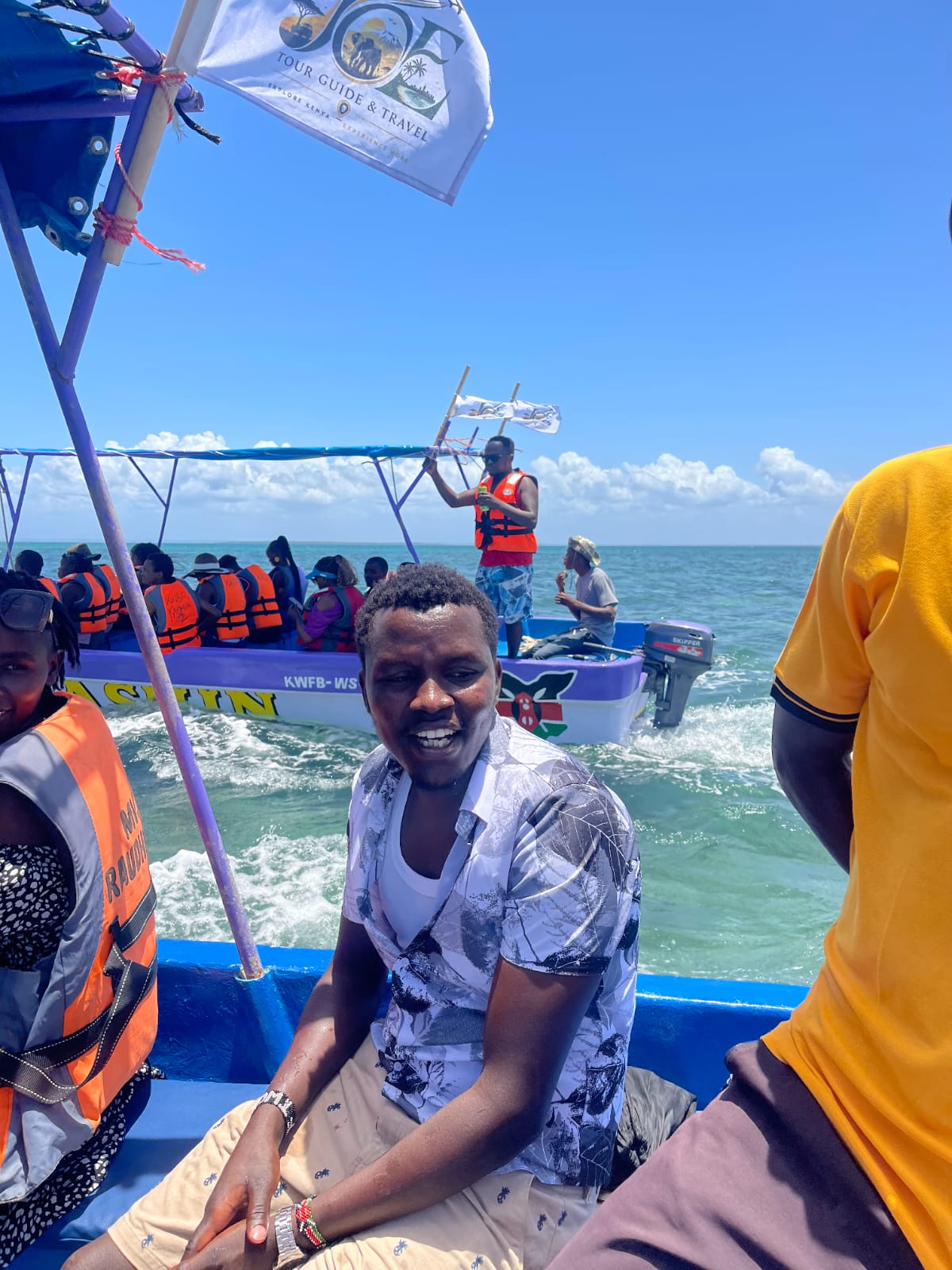 Guests in life jackets on a JOE Tour Guide boat trip off the Mombasa coast