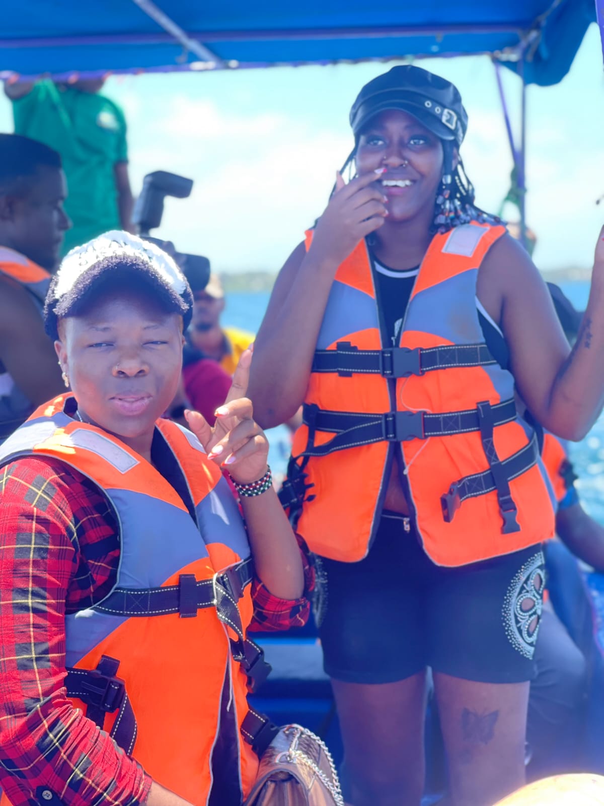 Two guests smiling aboard the boat