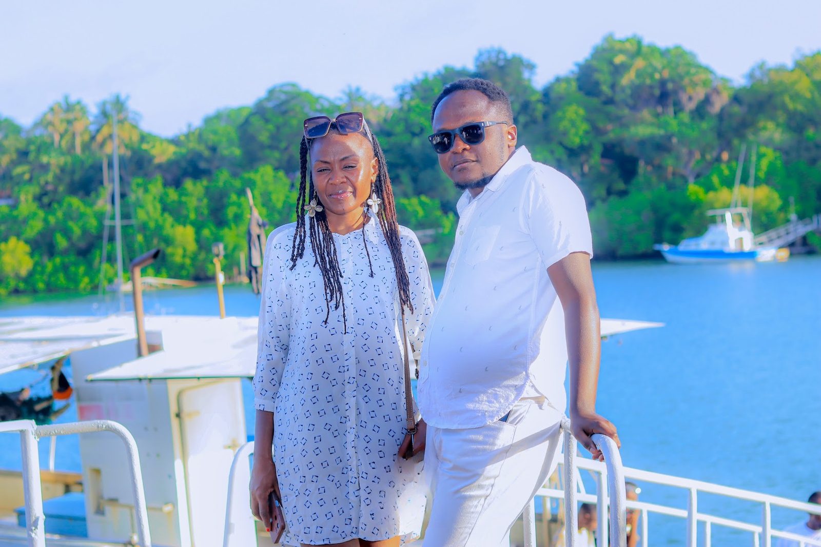 Couple in white on the boat deck