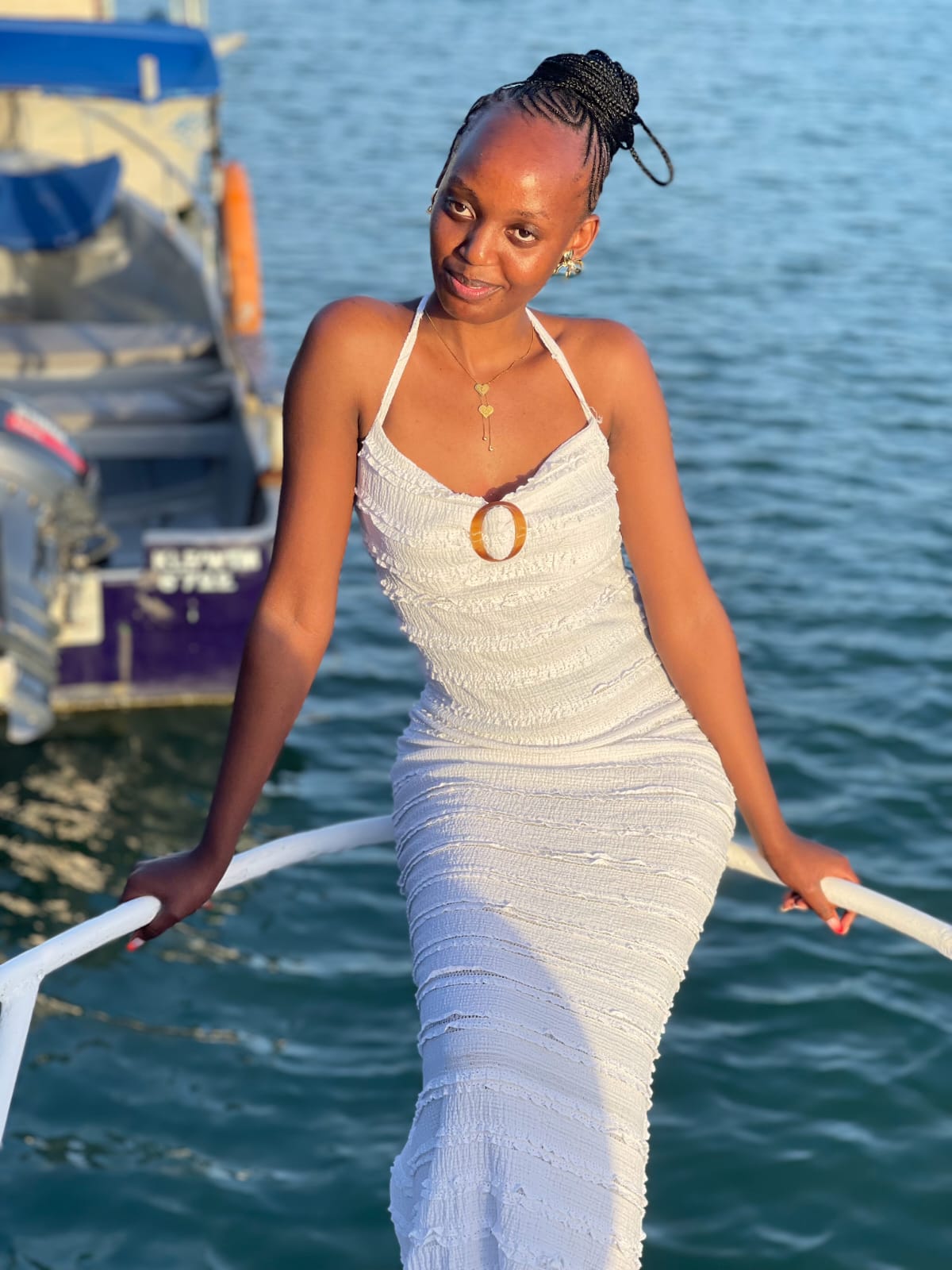Guest posing on the boat rail during the Mombasa creek gathering