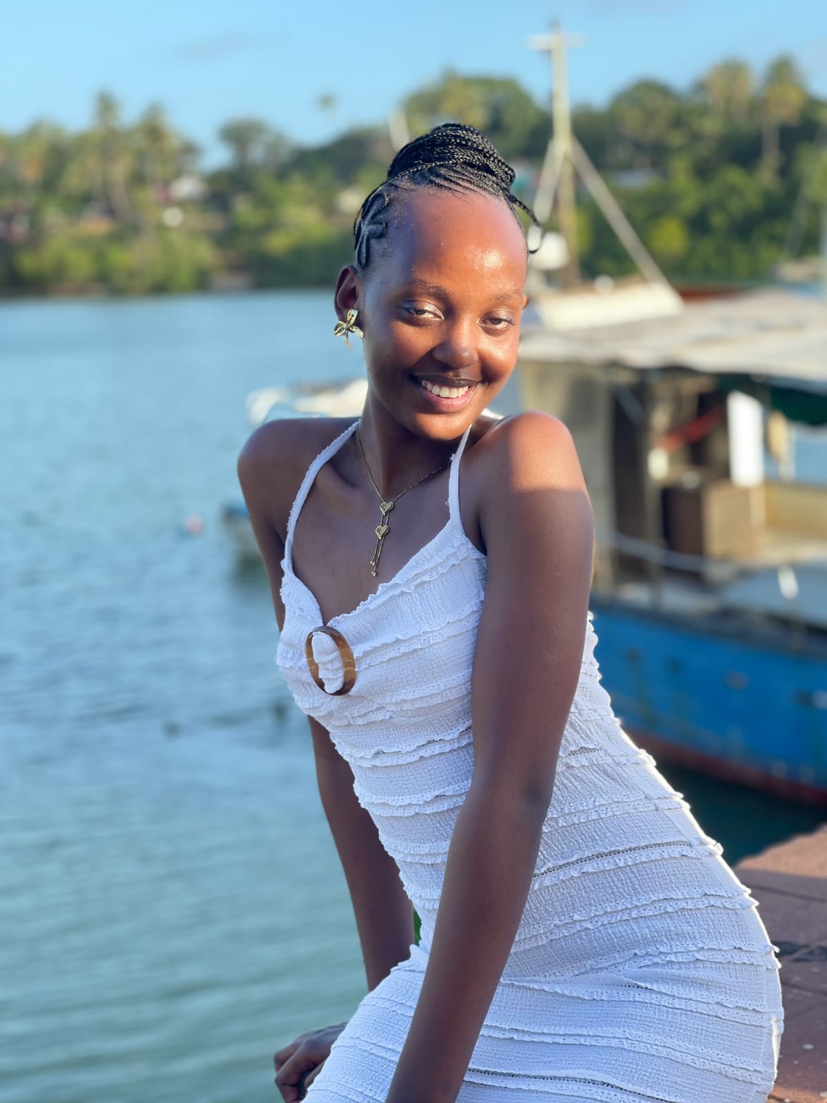 Guest smiling dockside during the Mombasa creek gathering