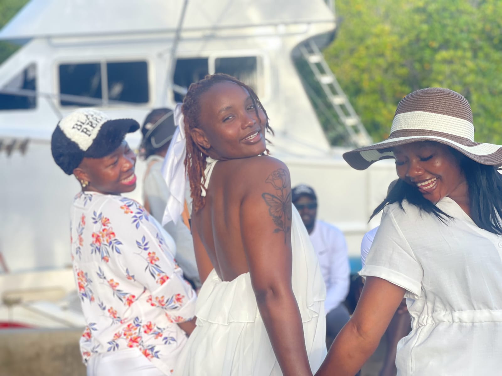 Guests smiling together at the Mombasa creek gathering