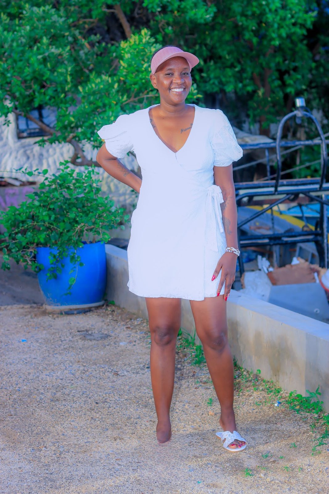Guest in a white dress at the creek jetty