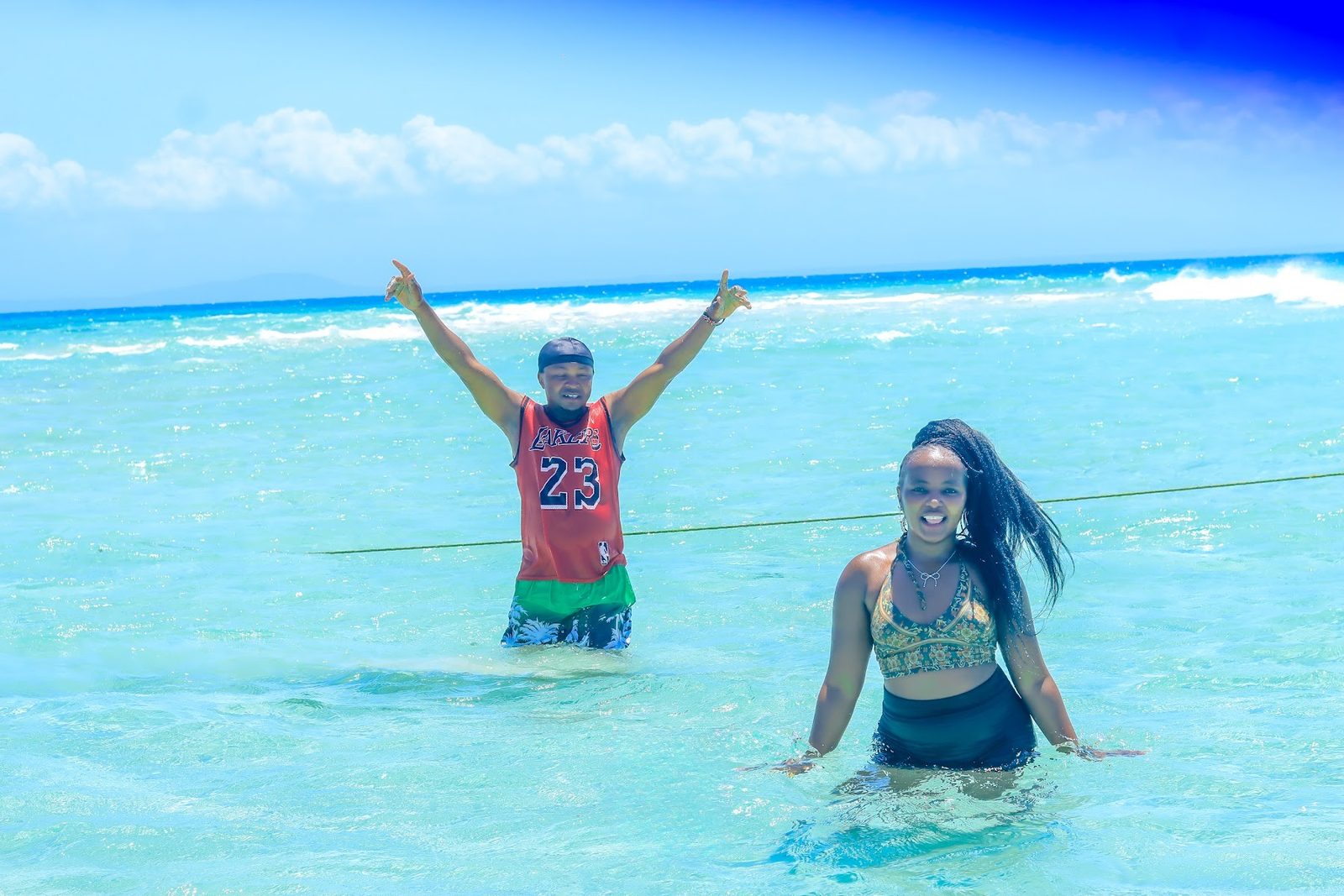 Guests playing in the shallow turquoise water
