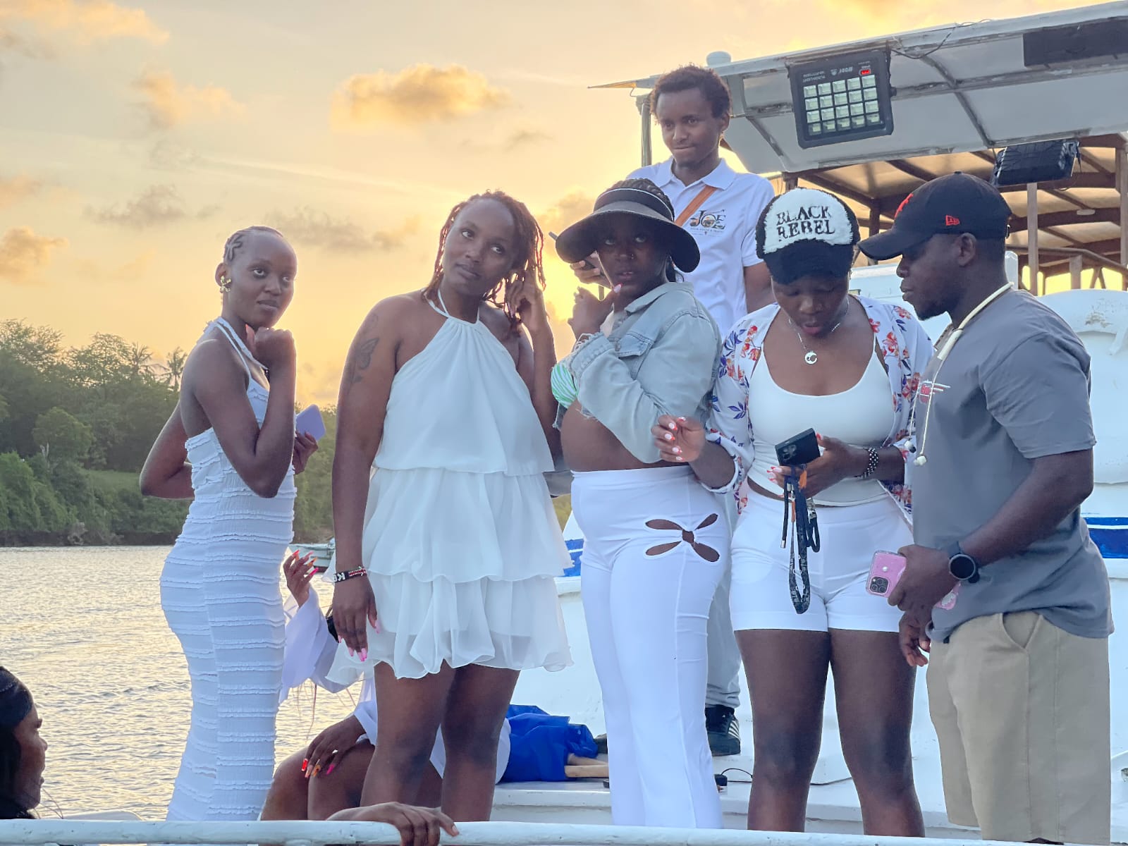 Guest posing on the bow of the boat with the creek behind her
