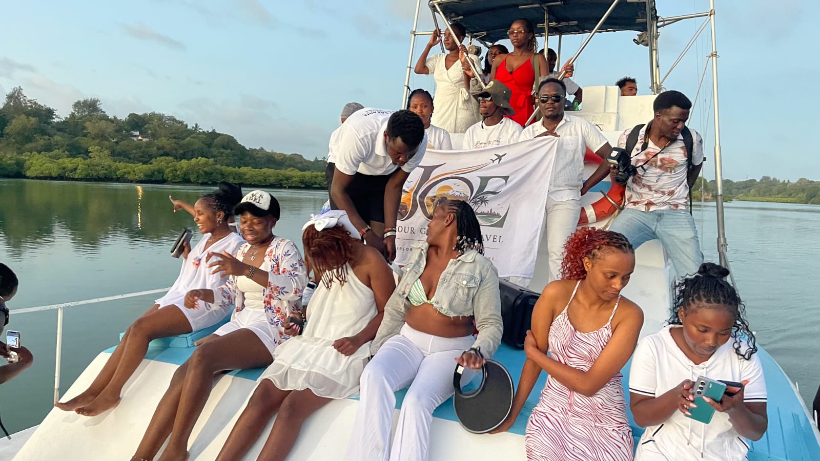 Guests dressed in white relaxing aboard the Mombasa sunset cruise