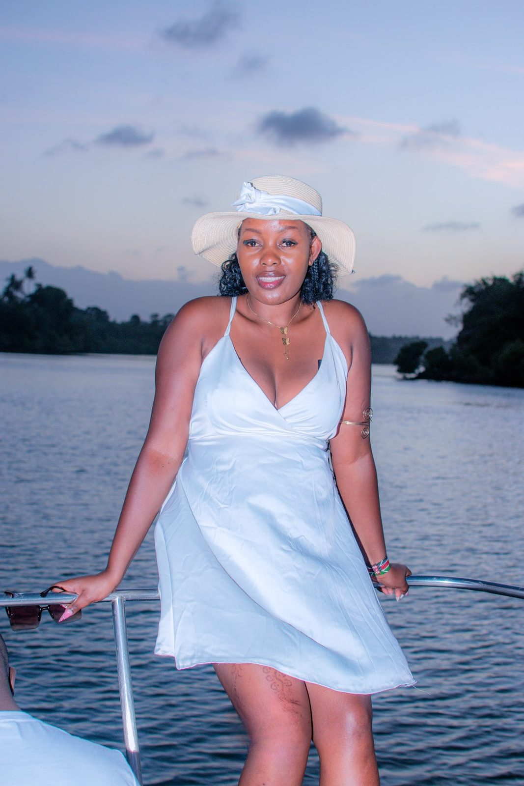 Guest in white at sunset on the creek