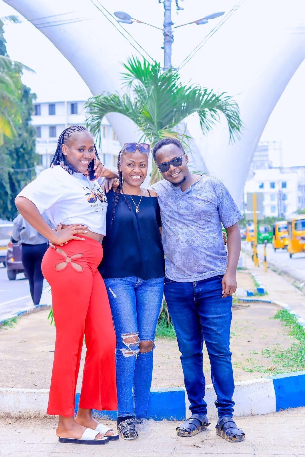 Three friends posing at the Mombasa Tusks
