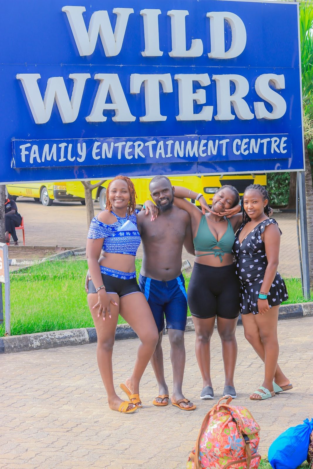 Guests at the Wild Waters entrance sign