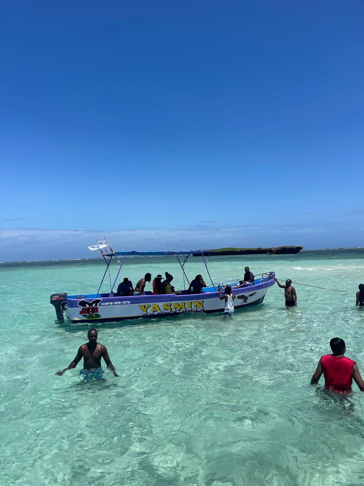 The Yasmin boat anchored in shallow turquoise water
