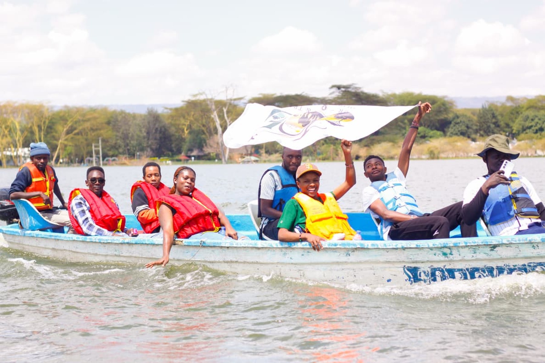 The full boat crew flying the flag on Lake Naivasha